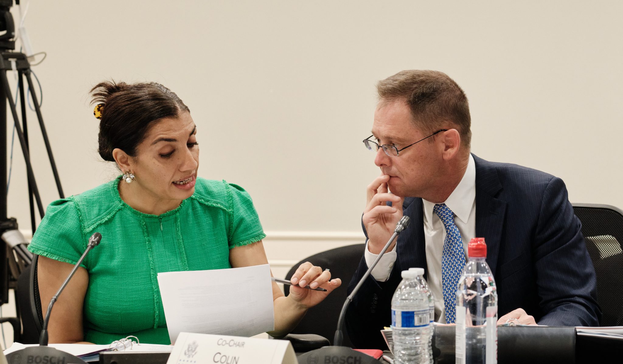 Chairs Shamila Chaudhary and Dr. Colin Jackson looking over documents